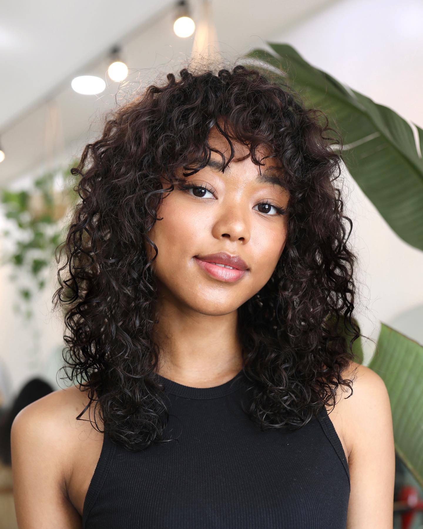 Don't hesitate to add front bangs to your naturally curly hair